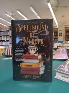 Book cover for the mystery novel 'Spellbound by Murder'