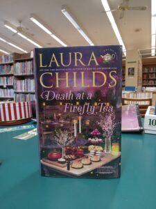 Book cover for the mystery novel 'Death at Firefly Tea'