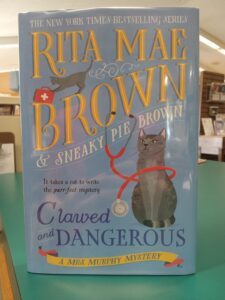 Cover for the mystery novel 'Clawed and Dangerous'