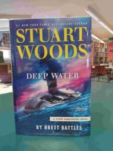 Cover for the novel 'Deep Water', featuring a yacht sinking into the water, with black smoke coming out of it