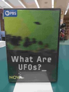 Photo of the case for the DVD 'What are UFOs?', featuring a blurry photo of a UFO on a green sky