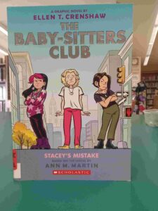 Photo of the cover for the graphic novel 'Stacey's Mistake', featuring 3 girls on a street in New York City